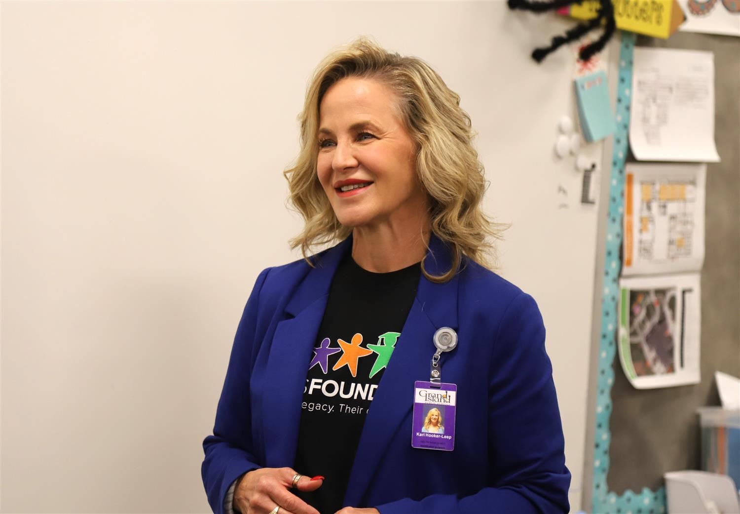 GIPS Foundation Executive Director, Kari Hooker-Leep, smiling in a Stolley Park classroom while presenting a classroom grant.